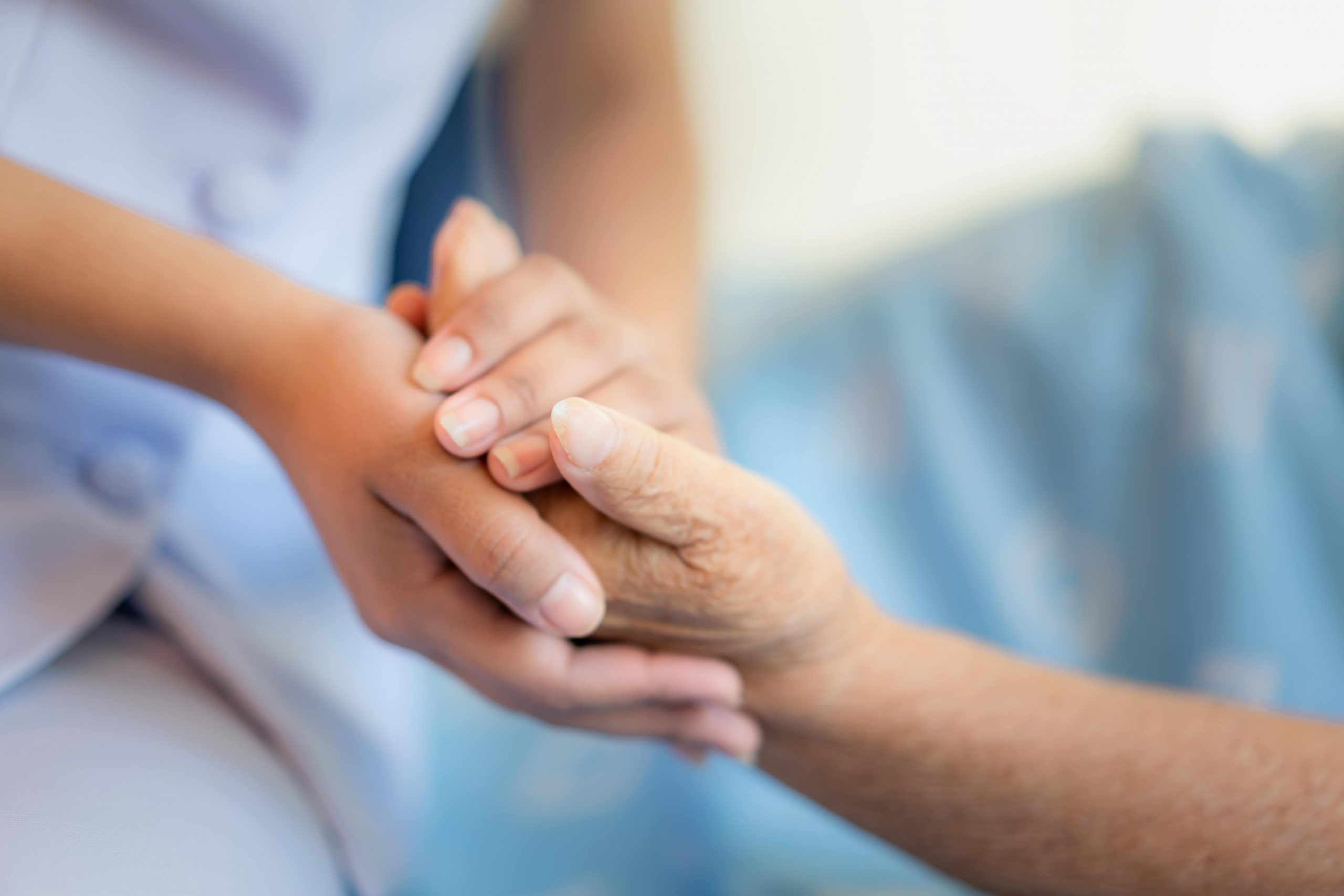 ShowEquip covers the care sector / industry. Image of a care worker comforting a patient.